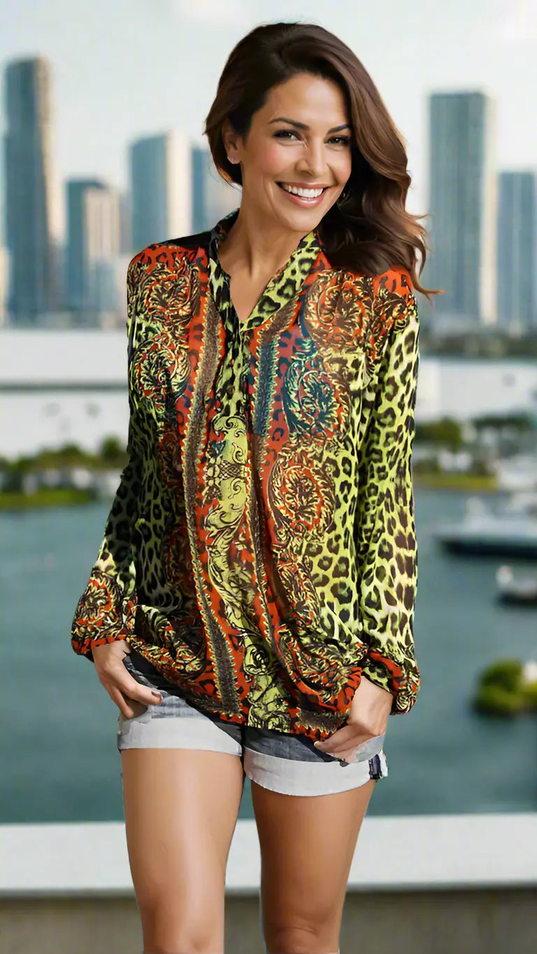 Animal print swim cover-up worn over swimwear at the beach, alternate view