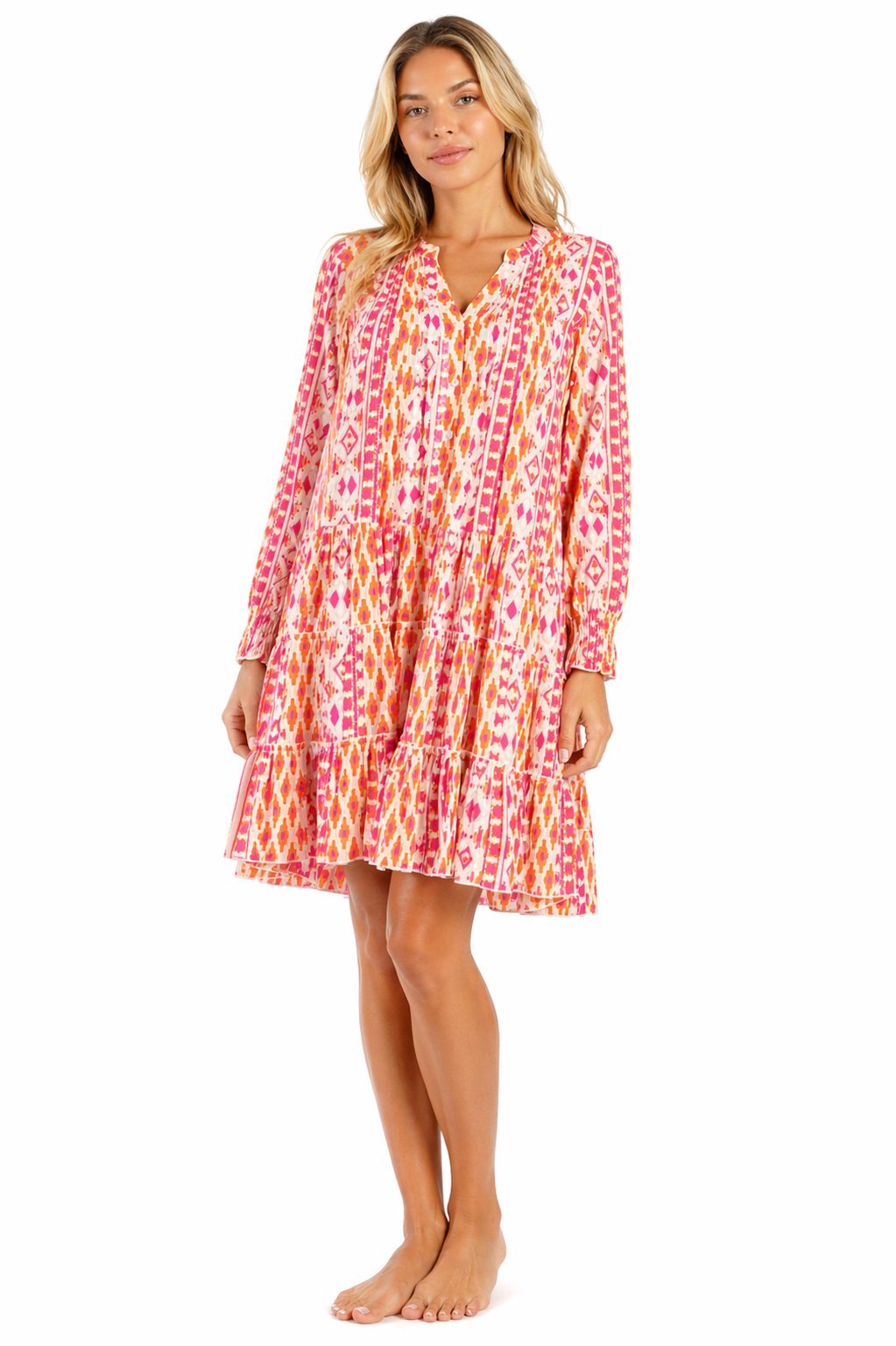 Pink ikat chevron print long-sleeve tiered mini dress — front view | Luxury resort wear from Club Moda