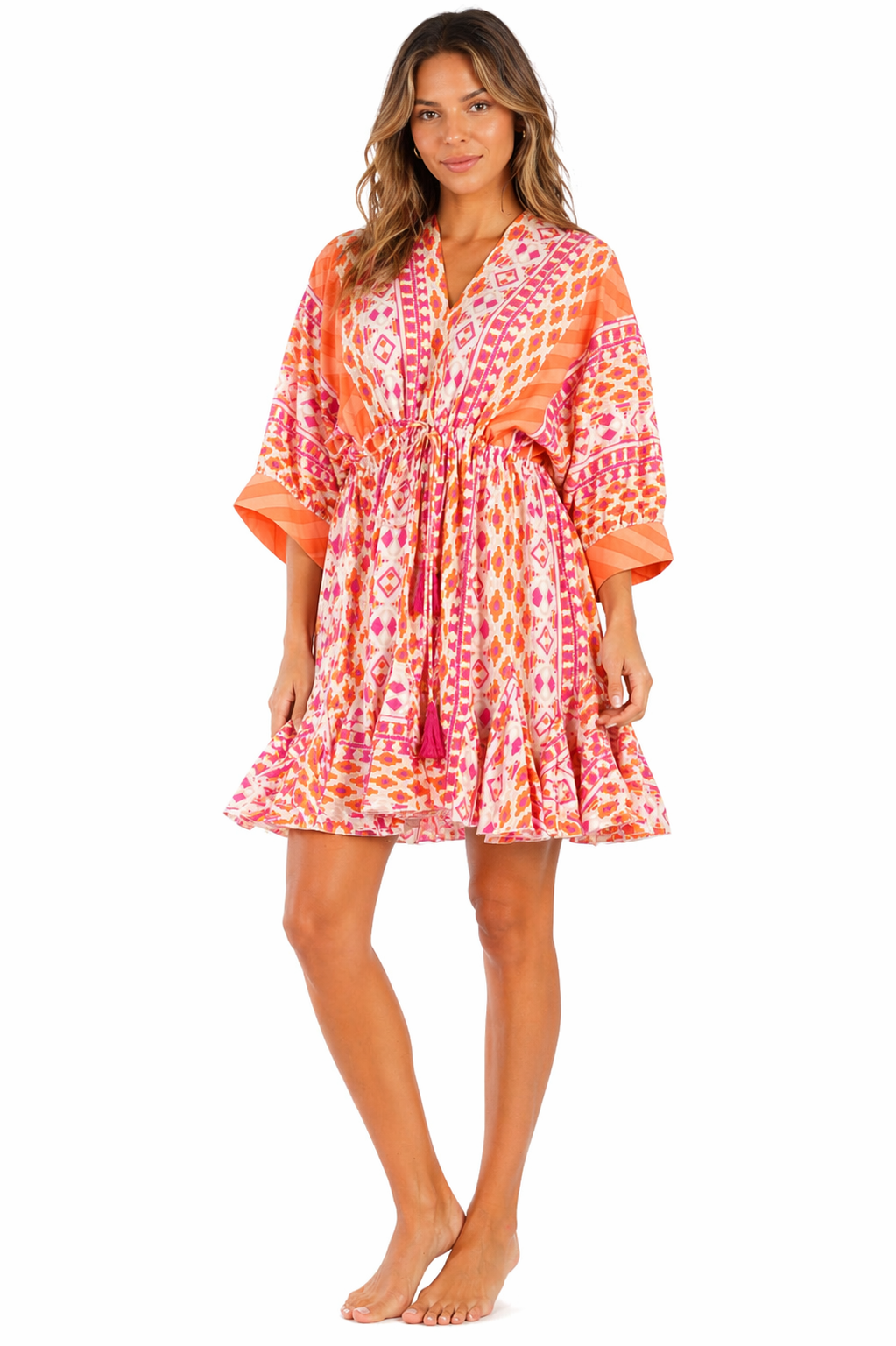 Coral sunset ikat gradient print tiered babydoll mini dress — side detail | Shop boho resort dresses at Club Moda