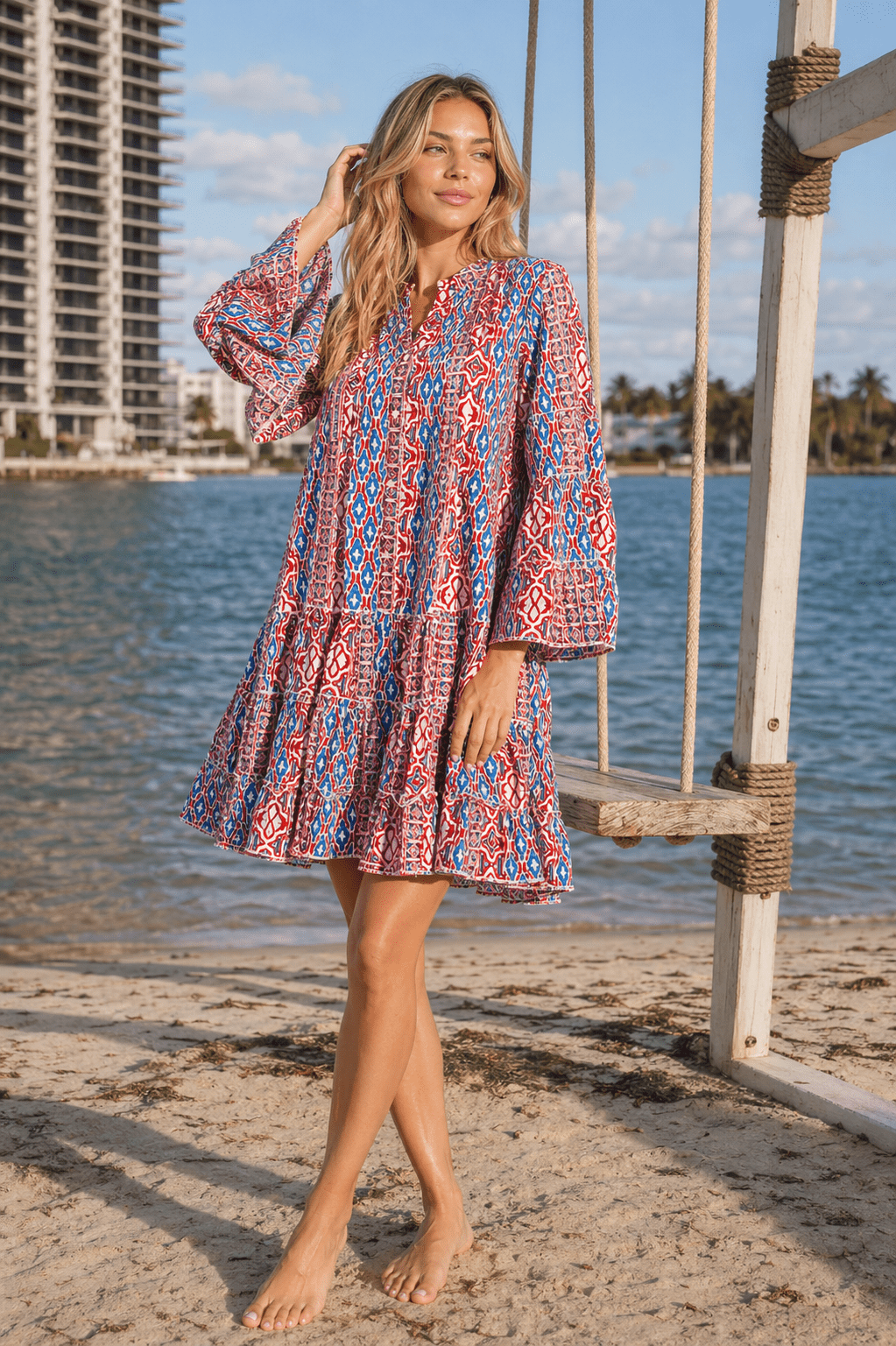 Red & Blue tribal block print bell-sleeve tiered boho mini dress — full styling shot | Beach-to-dinner resort dress